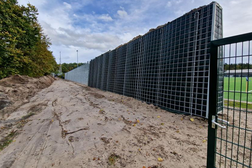 RAU Climatewall is being built next to a sports field.